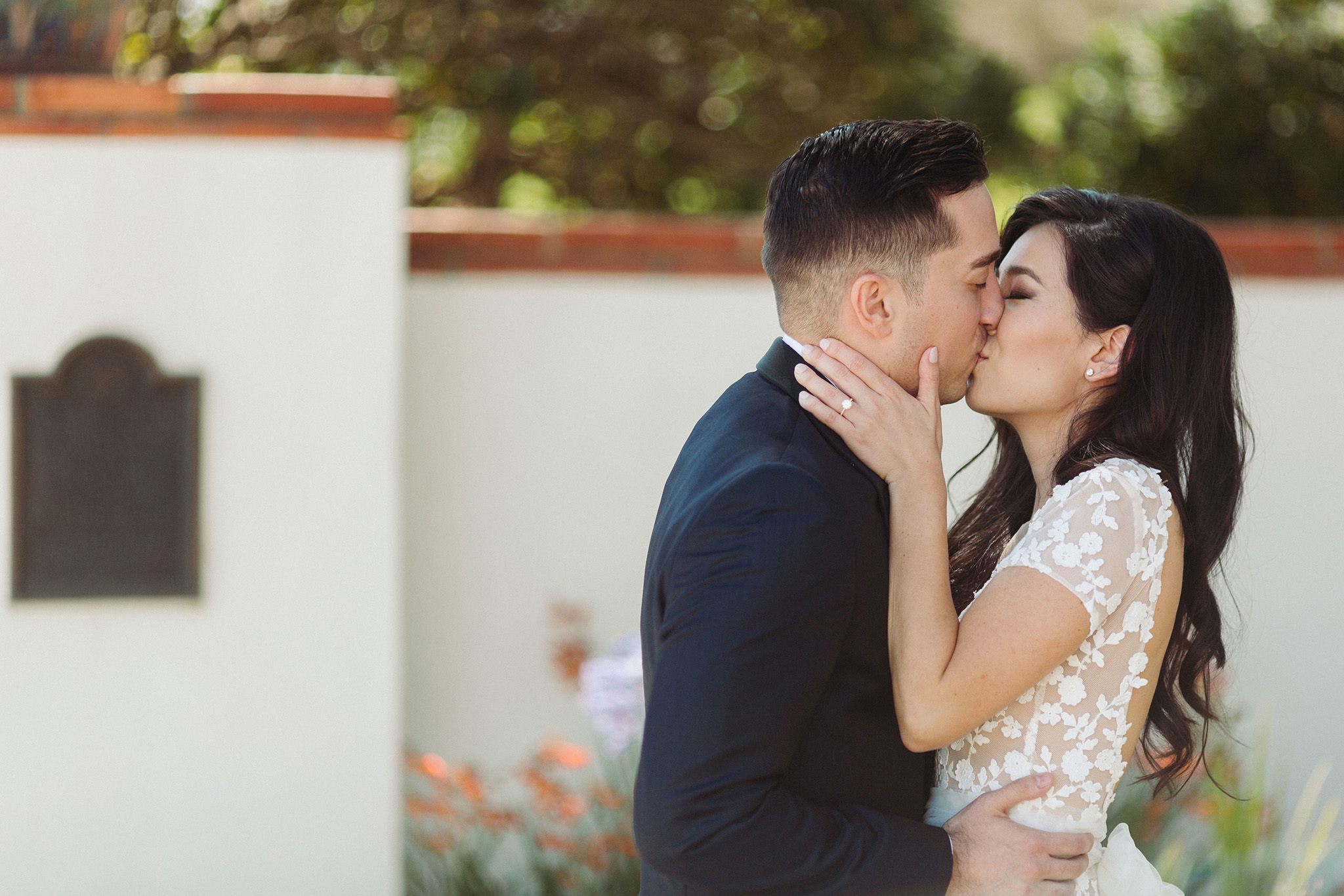 bride and groom kissing at their Adamson House Wedding