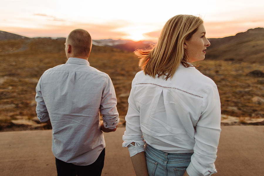 couple walking into the sunset at their engagement session