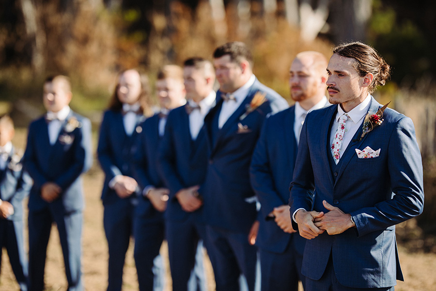 groomsmen at ceremony on the coast