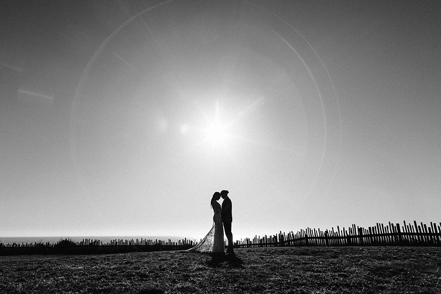 silhouette of bride and groom on the coast in mendocino